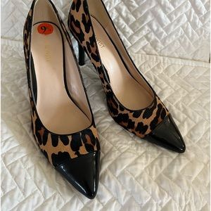 Nine West leopard print fur pumps with black patten heel and toe.